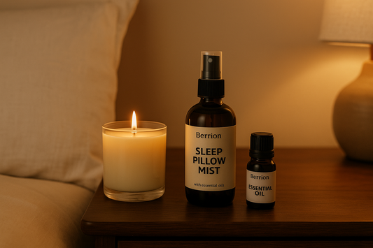 Berrion sleep aromatherapy banner with candle, pillow mist, and essential oil on bedside table creating a warm relaxing nighttime atmosphere.