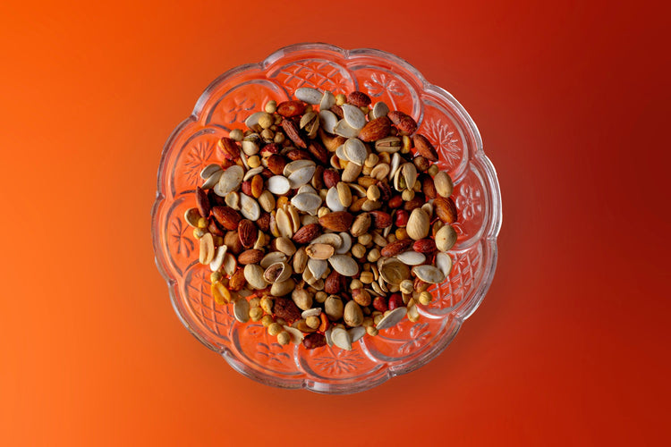 Berrion Premium Trail Mixes with assorted nuts, seeds, and dried fruit arranged naturally.