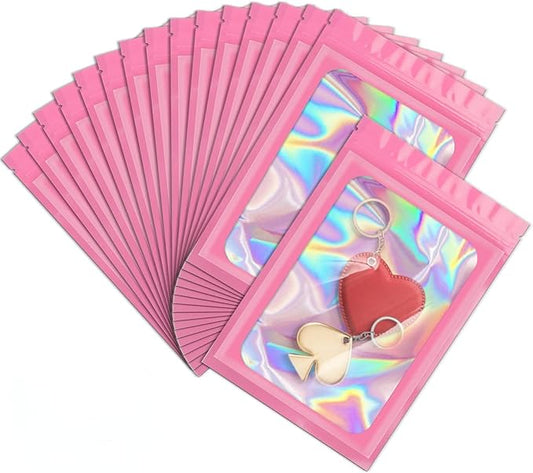 ANZNKU 100 Pack Mylar Bags Reasealable Holographic Bags, Smell Proof Bag Zipper Pouches with Clear Window, Jewelry Candy Sealable Bag for Packaging Sample Party Favor (Pink, 7.1 x 10.2 Inch)