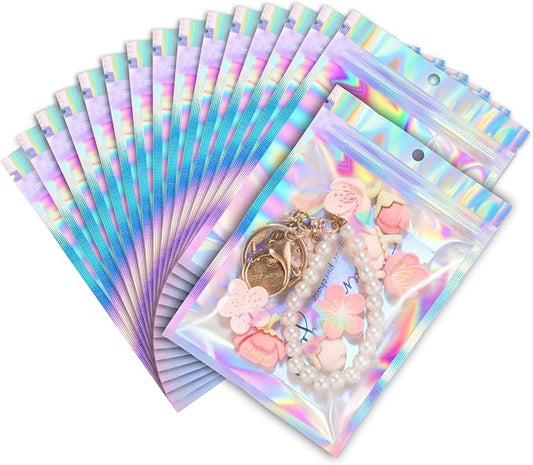 ANZNKU 100 Pack Mylar Bags Reasealable Holographic Bags, Smell Proof Bag Zipper Pouches with Clear Window, Jewelry Candy Sealable Bag for Packaging Sample Party Favor (3.9 x 7.1 Inch)