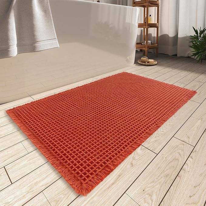 AMOAMI Upgraded Waffle Bath Mat, Super Absorbent Non Slip Bath Mats for Bathroom Floor, Machine Washable Bathroom Rugs with Tassels, Rubber Backed Bathroom Mats, Ultra Soft, 20" x 32", Orange